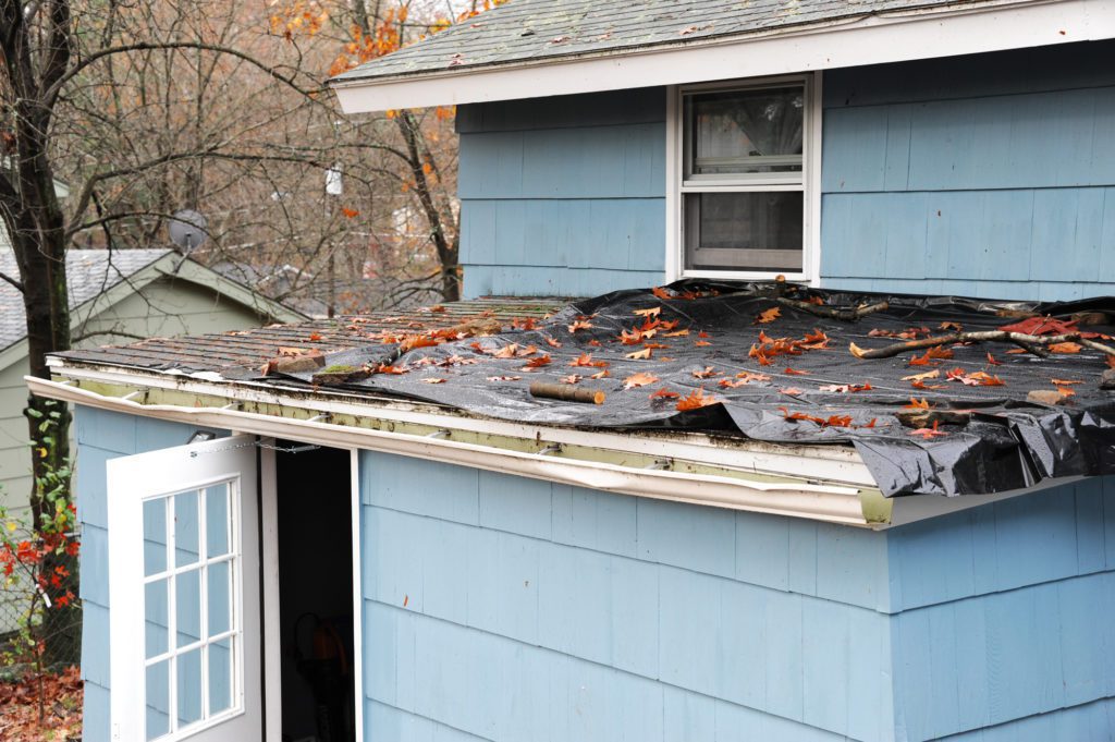 house roof damaged in hurricane storm, roofing, roof, roof replacement, roof repair, Minnesota, Minnesota roof